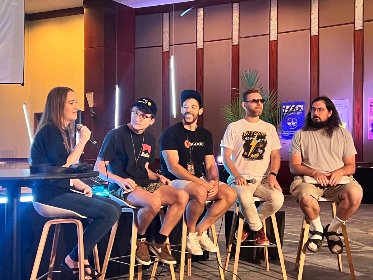 Founders on a panel in front of a builder crowd